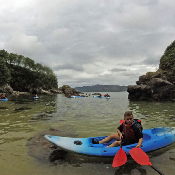 Group of Kayakers between Sea Stacks