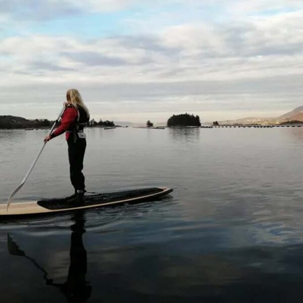 Stand up Paddle Boarder admires the view