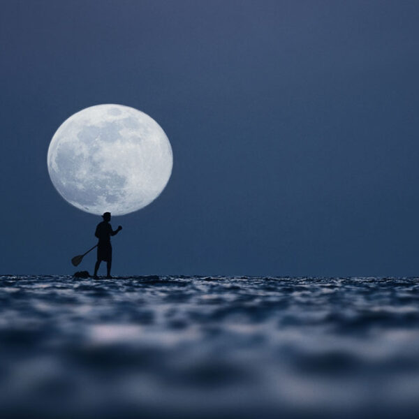 Stand up Paddling under full moon